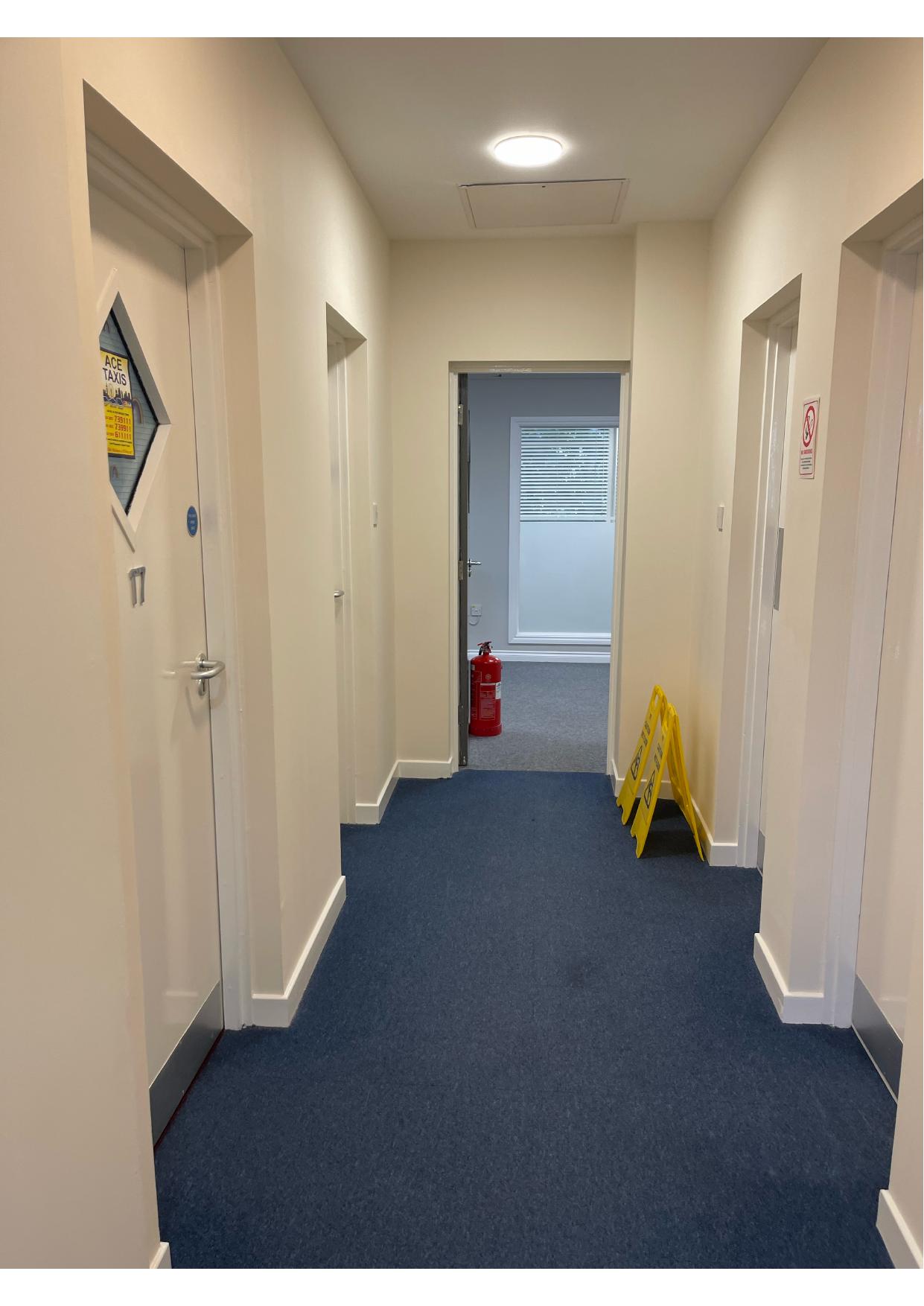 Blue painted communal corridor in a managed residential block